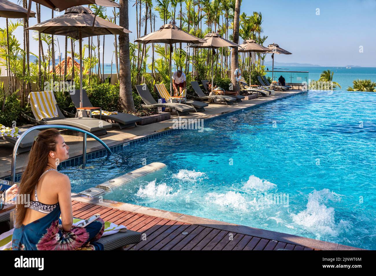 Swimming pool at beachfront hotel, Pattaya, Chon Buri, Thailand Stock Photo
