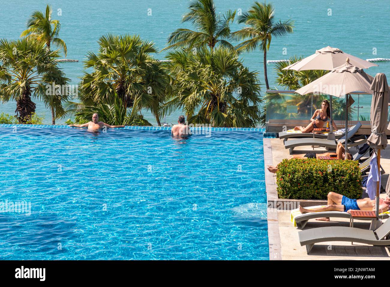 Swimming pool at beachfront hotel, Pattaya, Chon Buri, Thailand Stock Photo