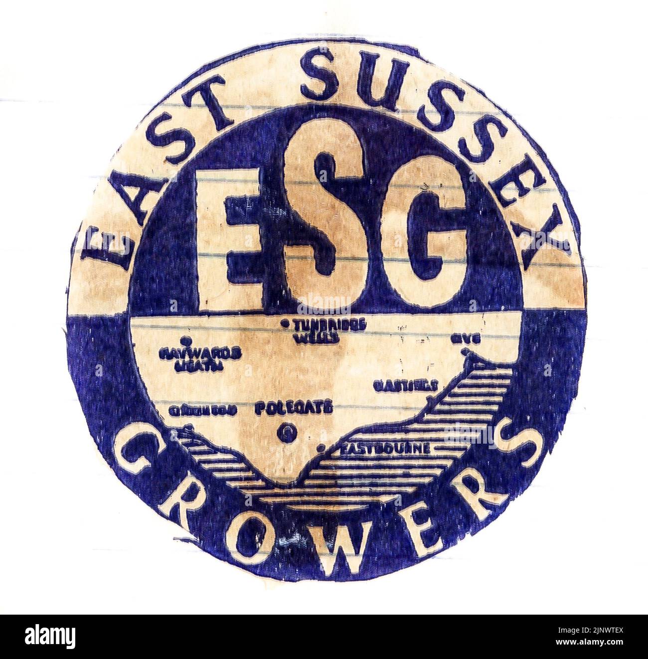 Fresh fruit tissue paper wrapper, from mid-1950s England, with grower's trade mark. ESG, East Sussex Growers. Blue and white map of Sussex, England. Stock Photo