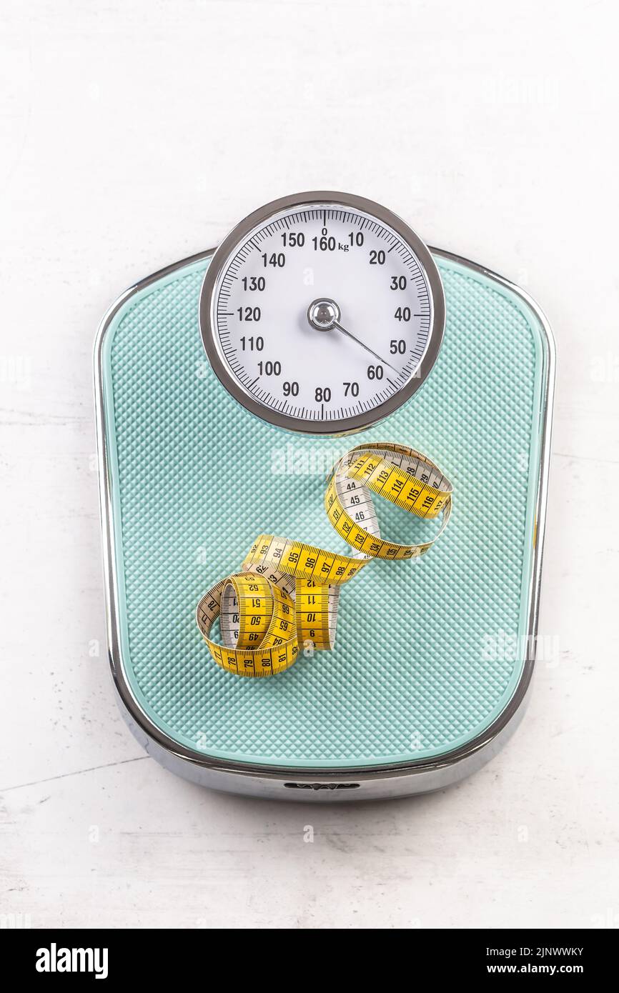 Weight scale with measure tape on floor - Top of view. Stock Photo
