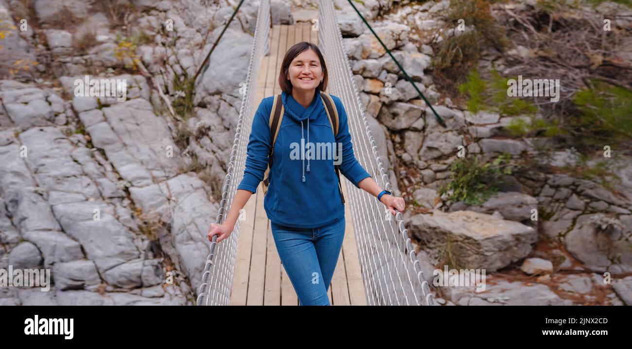 travel to Turkey, Kemer in autumn seasone. famous part of Lycian Way, Goynuk Canyon. Woman hiker trekking in mountains. Young lady walking with backpack in forest. Stock Photo