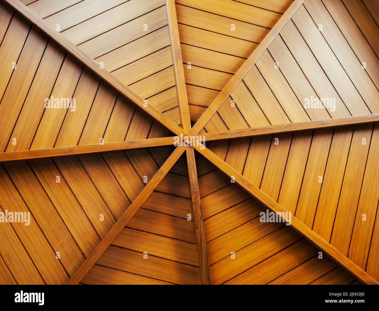 Wooden construction background, arranged to round shape, under the roof. Interior structure of a domed wood plank ceiling, circle pattern, spider web Stock Photo