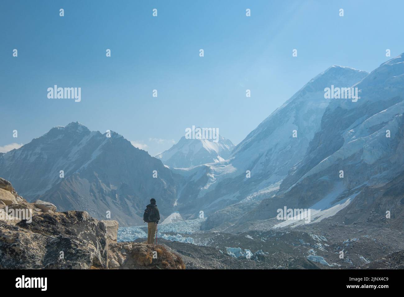 Male backpacker enjoying the view on mountain walk in Himalayas ...