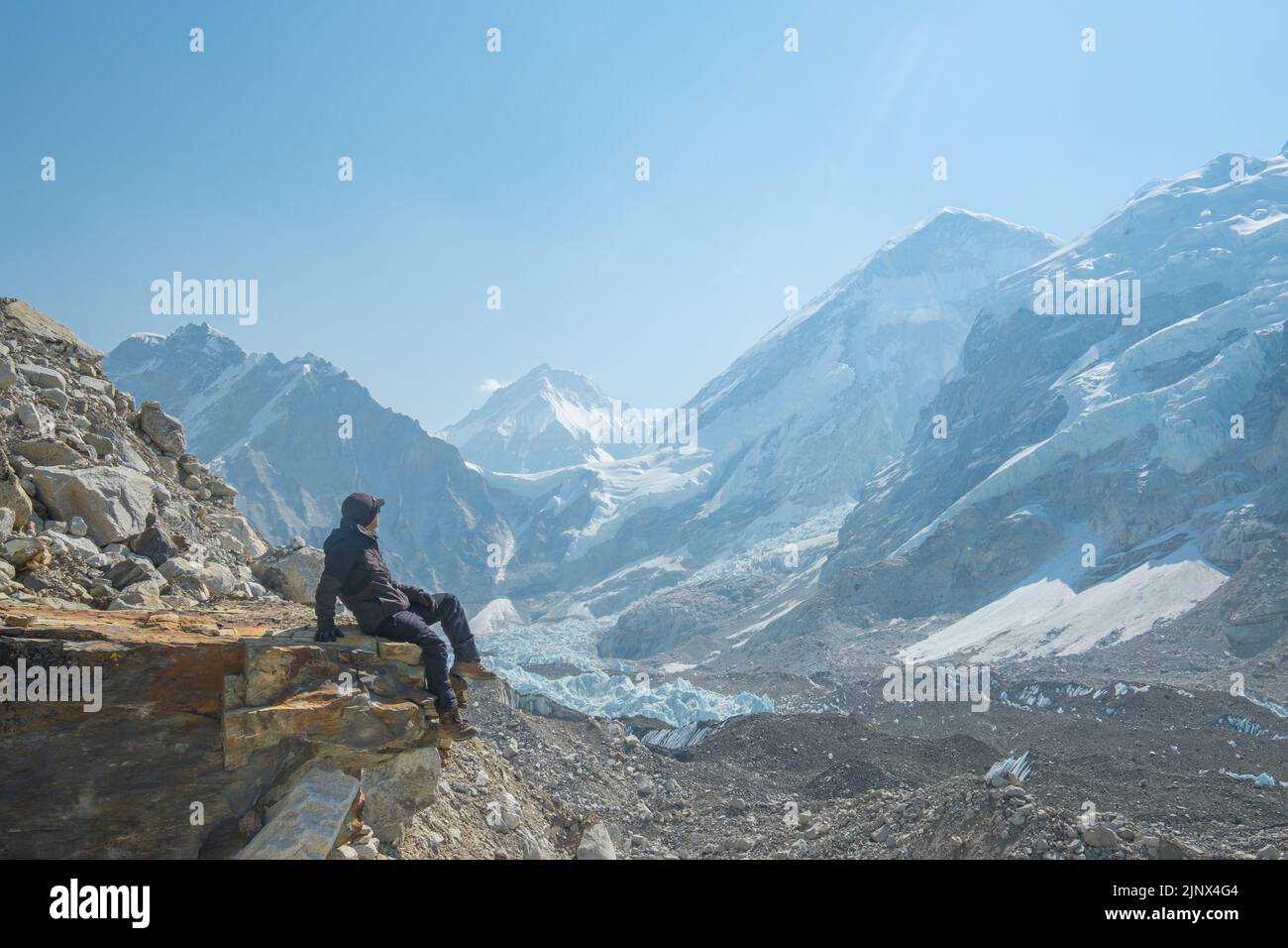 Male backpacker enjoying the view on mountain walk in Himalayas