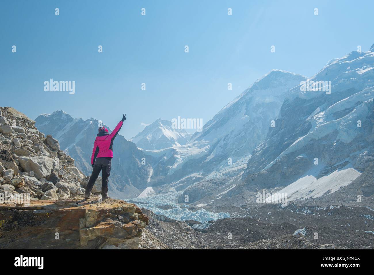 Female backpacker enjoying the view on mountain walk in Himalayas