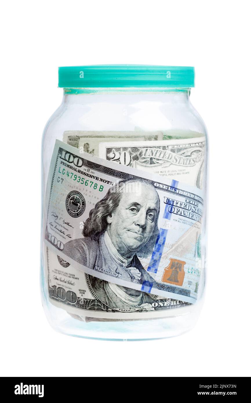Dollars, money in glass jar for economic and business articles. Stock Photo