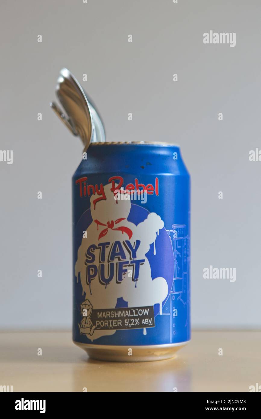 A beer can that has exploded due to the beer undergoing secondary