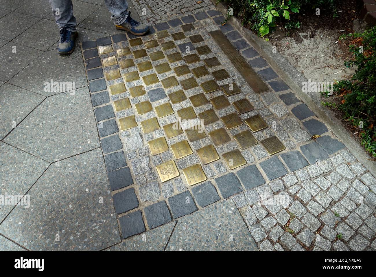 The names of 56 German diplomats who fell victim to the Nazis engraved in brass: the artist Gunter Demnig laying his 'Stolpersteine' , Berlin Stock Photo