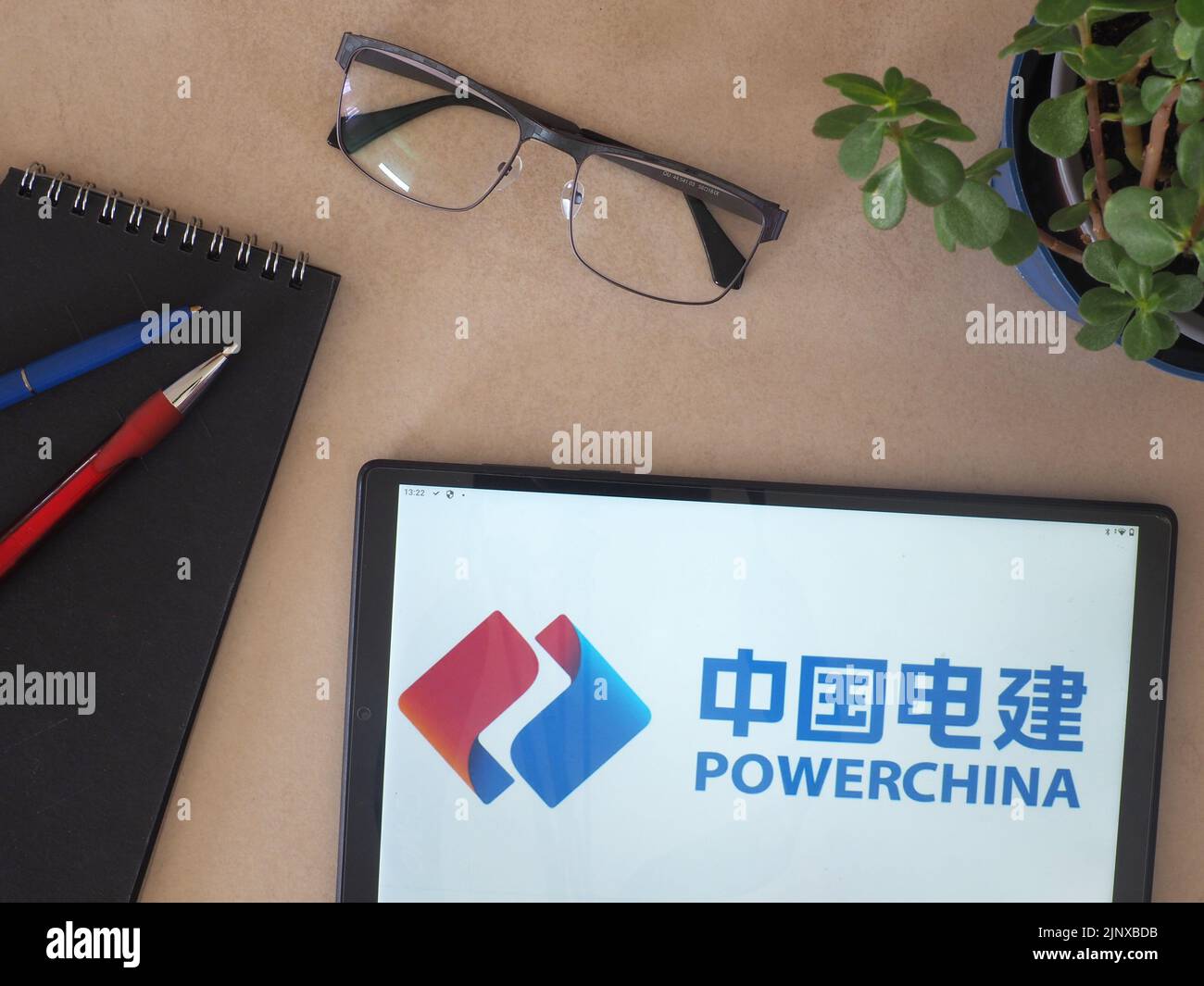 In this photo illustration, Power Construction Corporation of China Limited logo seen displayed on a tablet Stock Photo