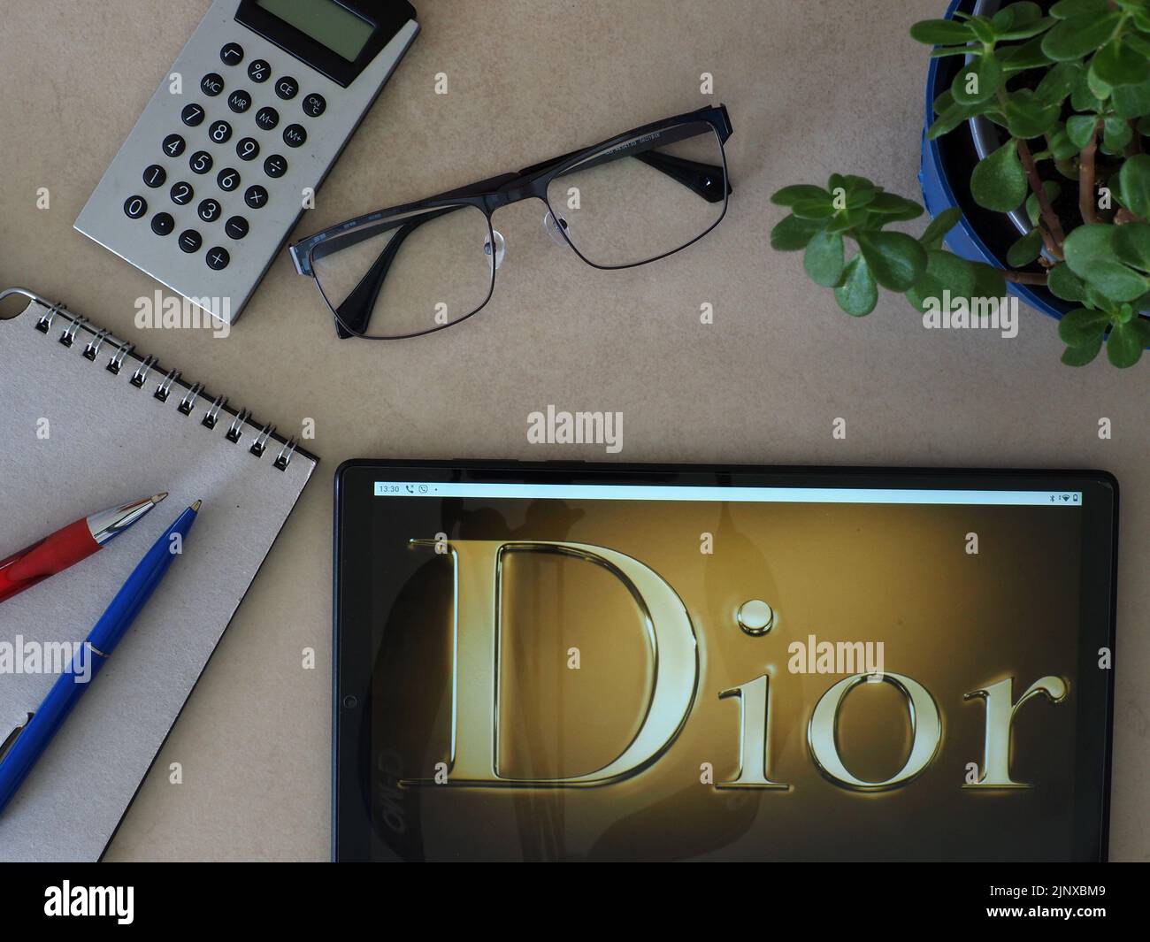 In this photo illustration, Christian Dior SE logo seen displayed on a tablet Stock Photo