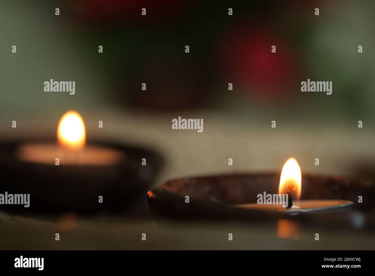 Burning candle in the dark. Candles light in traditional bowl ceramic
