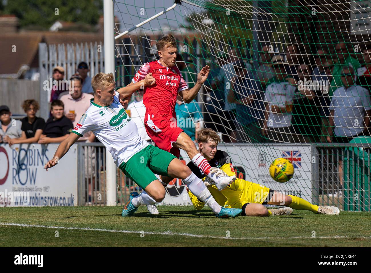 Isthmian League Premier goal action: Bognor Regis goalkeeper Toby Steward and defender Tom Bragg tackle Hornchurch to keep the ball out of the net. Stock Photo