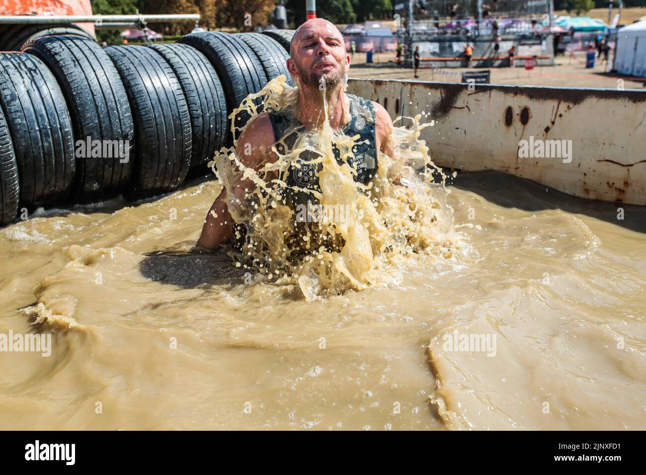 London UK 14 August 2022 Competitors of the Tough Mudder event in Morden Park London cherishing the challenge of conquering the different obstacles put between them and victory, Paul Quezada-Neiman/Alamy Live News f Stock Photo