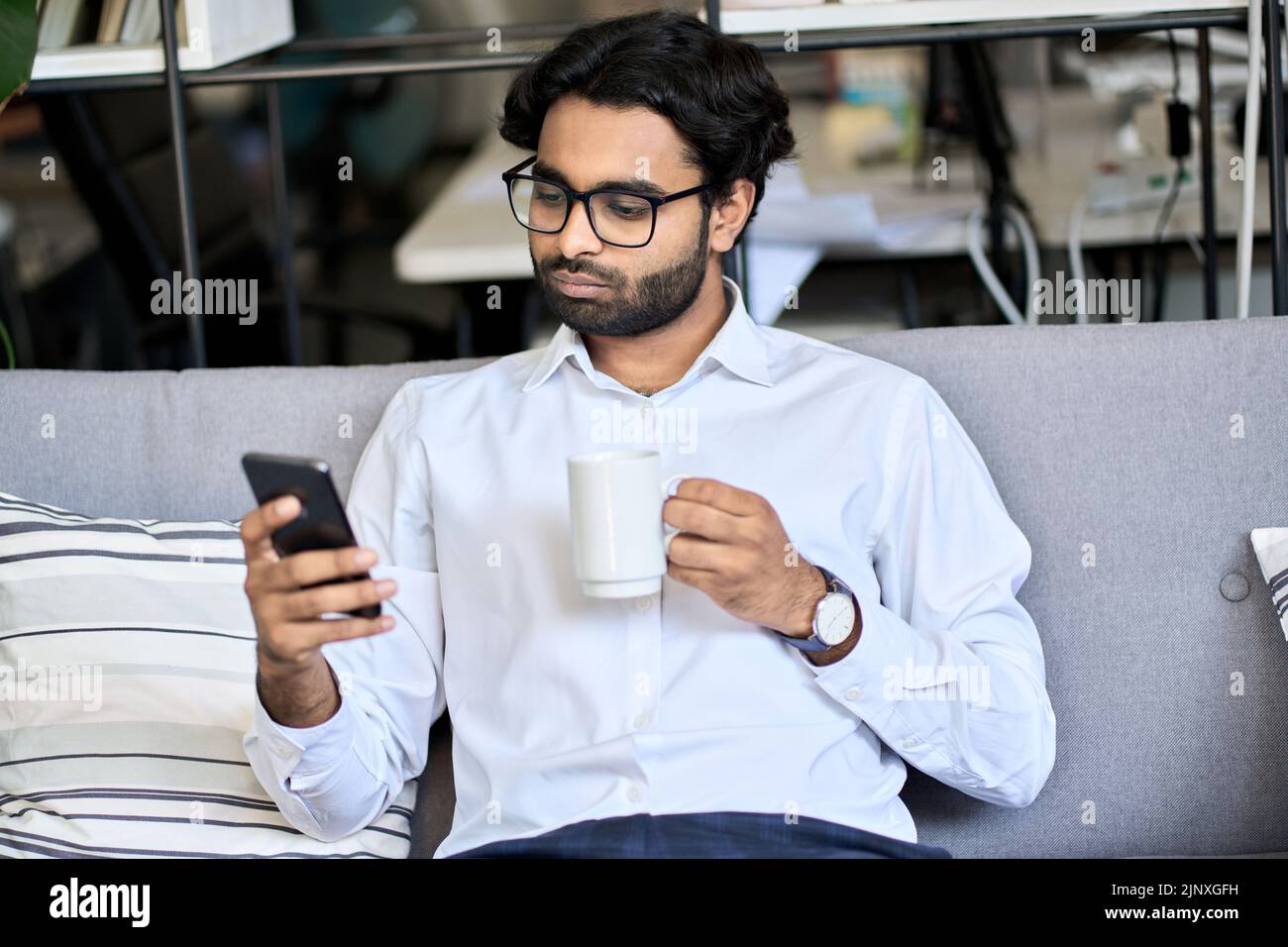 Arab man sitting in sofa hi-res stock photography and images - Alamy