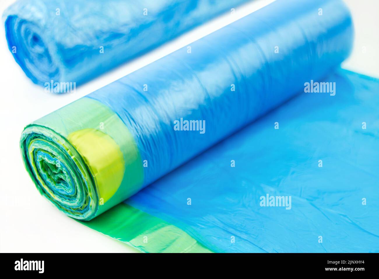 Two blue garbage bags on white background Stock Photo