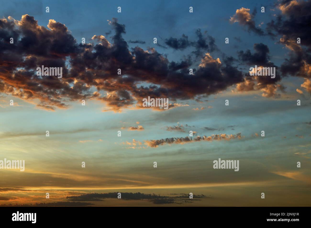 Cloud patterns at twilight over Cornwall, the sun is below the distant horizon. Stock Photo