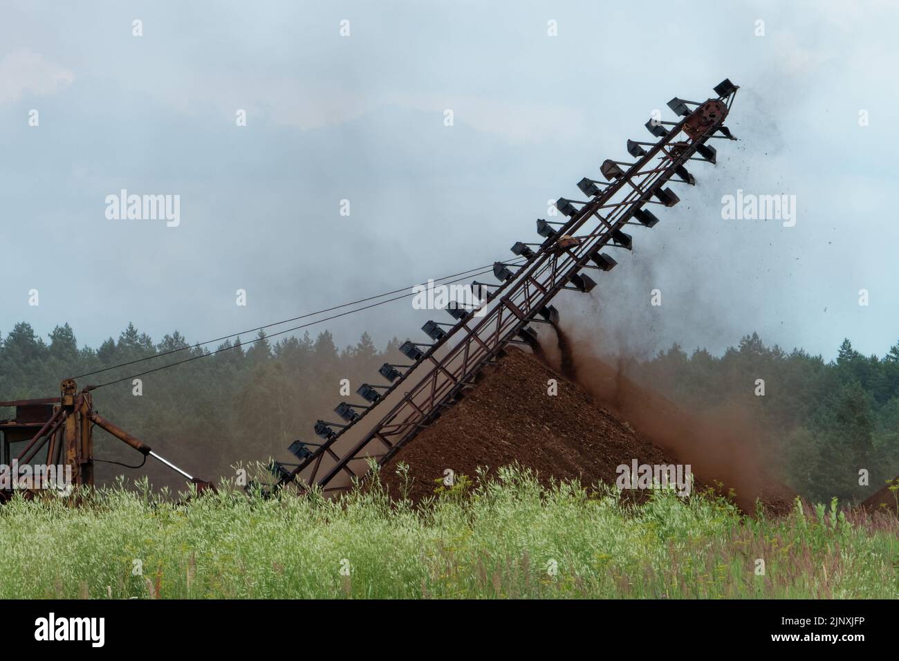 Industrial milled peat production in Saara bog, Estonia. Stock Photo