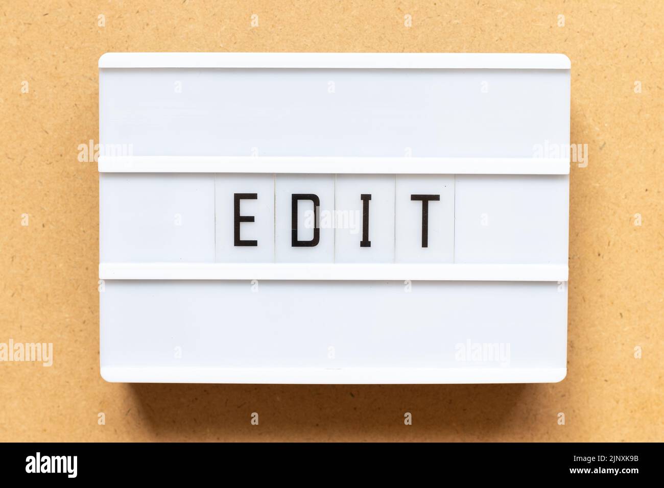 Lightbox with word edit on wood background Stock Photo