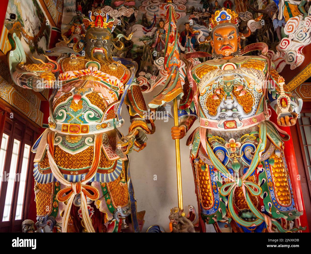 Traditional Chinese religious symbols or sculptures inside a temple ...