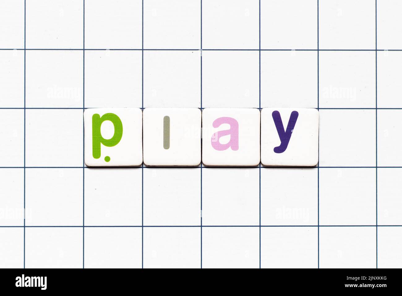 Colorful tile letter in word play on white grid background Stock Photo