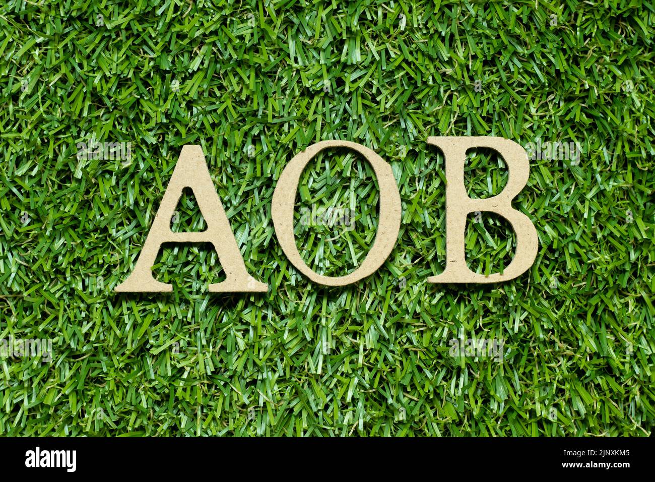 Wood alphabet letter in word AOB (abbreviation of Assignment of