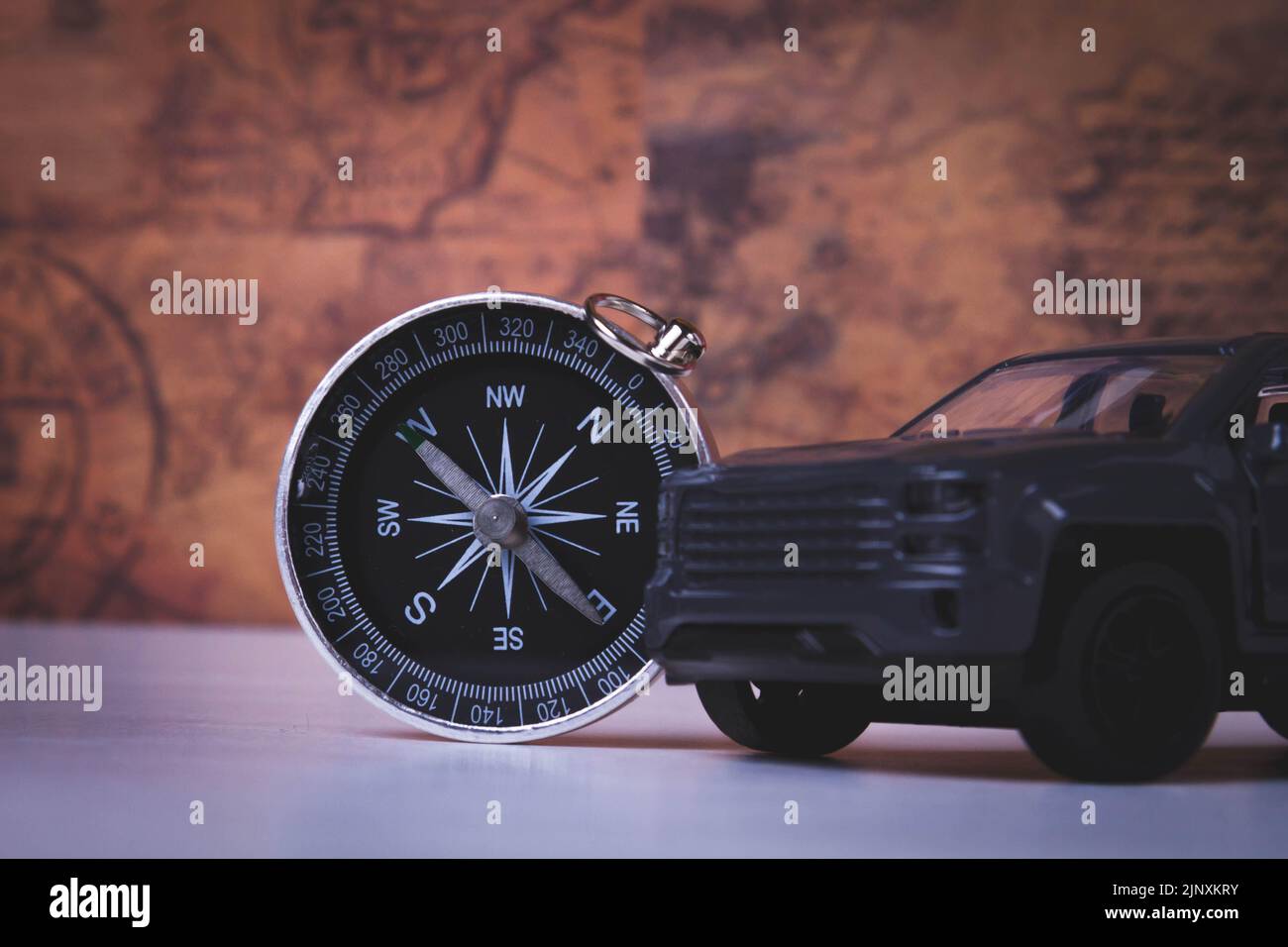 Tourist travel by car. Travel by car. Compass and car. Autotourism