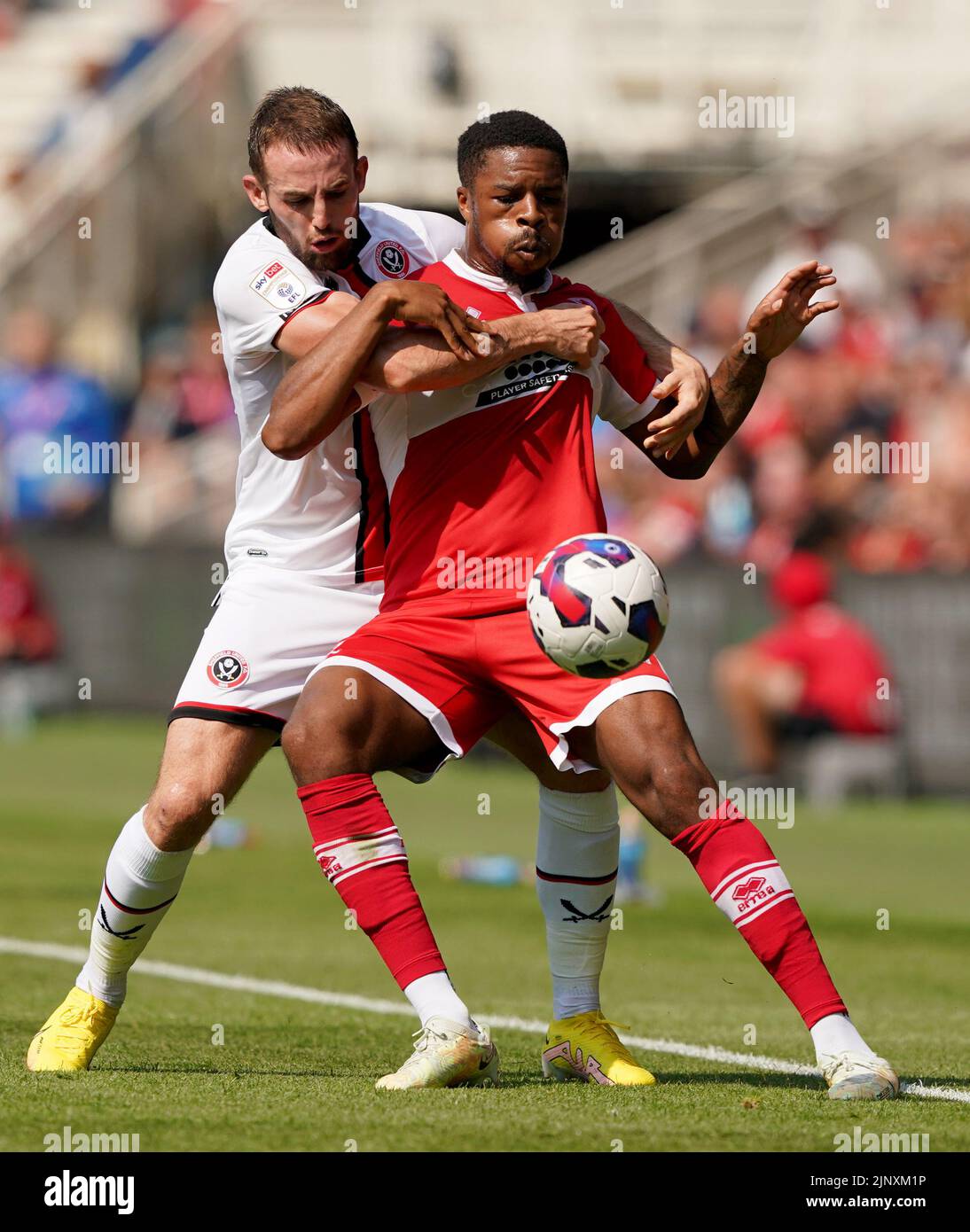 Sheffield United's Rhys Norrington-Davies battles with Middlesbrough's Chuba Akpom during the Sky Bet Championship match at the Riverside Stadium, Middlesbrough. Picture date: Sunday August 14, 2022. Stock Photo