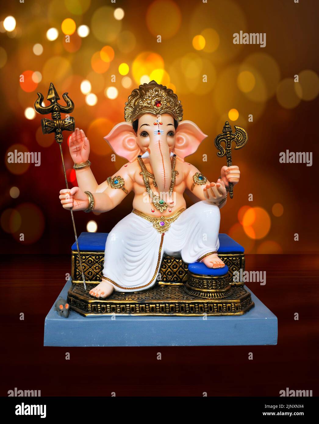 Hindu God Ganesha on colourful bokhe background, Ganesha Idol. Ganesh festival. Stock Photo