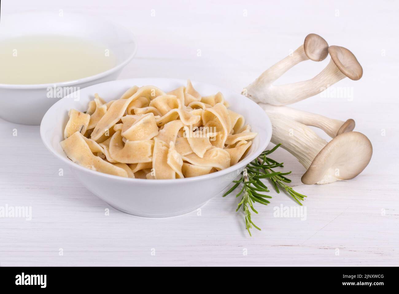 Fresh pasta with mushrooms and rosemary Stock Photo