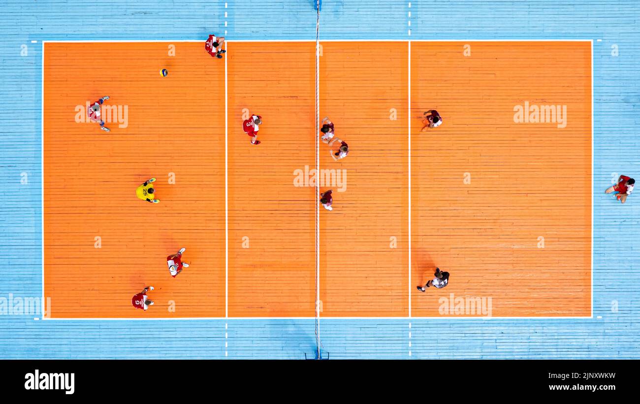 Aerial view of playing volleyball. Top view of the volley ball court during game. Stock Photo