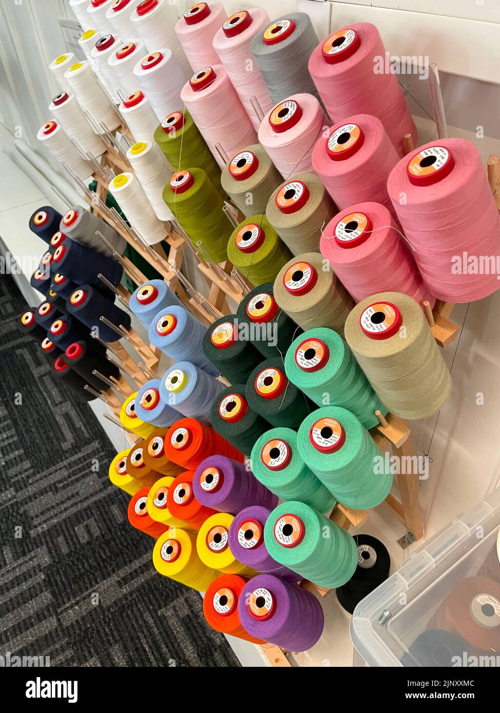 colourful reels of sewing thread or yarn in fashion studio