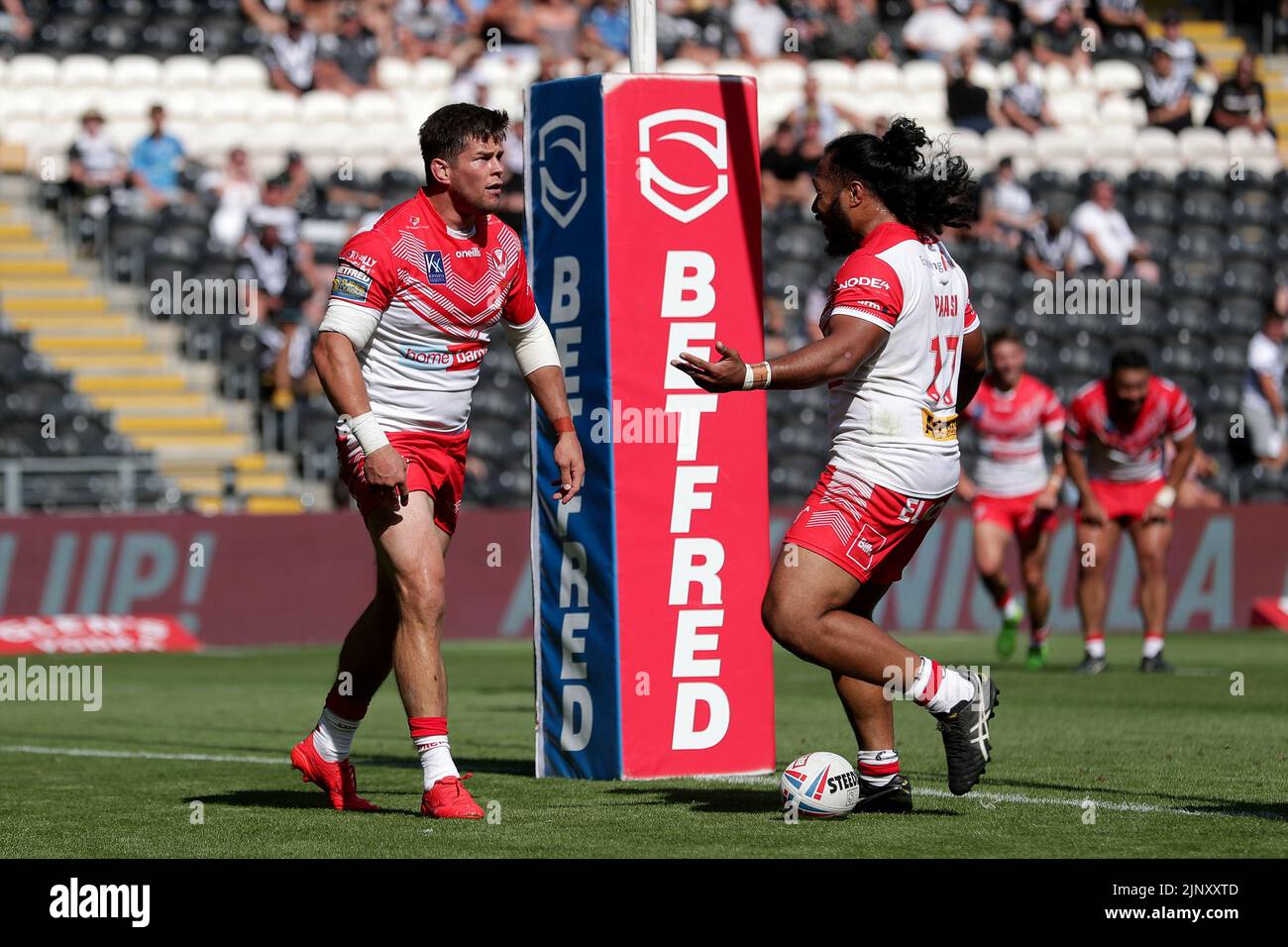 Saint Helens Louie McCarthy-Scarsbrook celebrates his second try with team-mate Agnatius Paasi during the Betfred Super League at the MKM Stadium, Kingston upon Hull. Picture date: Sunday August 14, 2022. Stock Photo