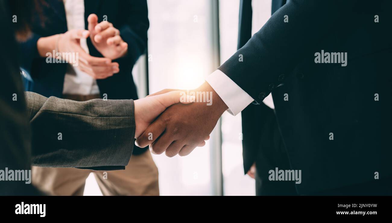 businessman handshake for teamwork of business merger and acquisition Stock Photo