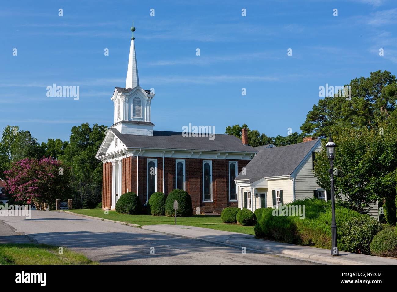 View of the historic town of Boydton in Virginia. Methodist church looking splendid in the hot summer sunshine. Stock Photo
