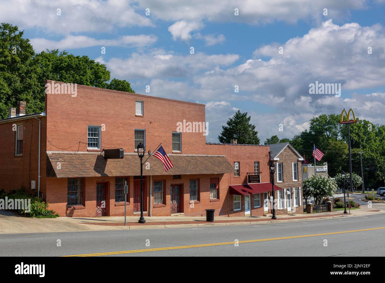 Small town of Clarksville in Virginia state. Mixed row of businesses along the main street. Stock Photo