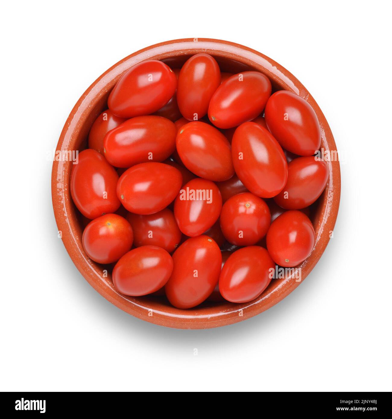 Plum tomatoes in bowl cut out on white background Stock Photo - Alamy