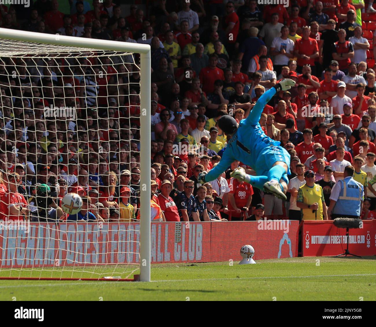 Nottingham, UK. 14th August 2022;  The City Ground, Nottingham, Nottinghamshire, England; Premier League football, Nottingham Forest versus West Ham : Nottingham Forest's Dean Henderson is beaten by a shot from West Ham United's Pablo Fornals but it hits the bar and comes down on the goal line Credit: Action Plus Sports Images/Alamy Live News Stock Photo