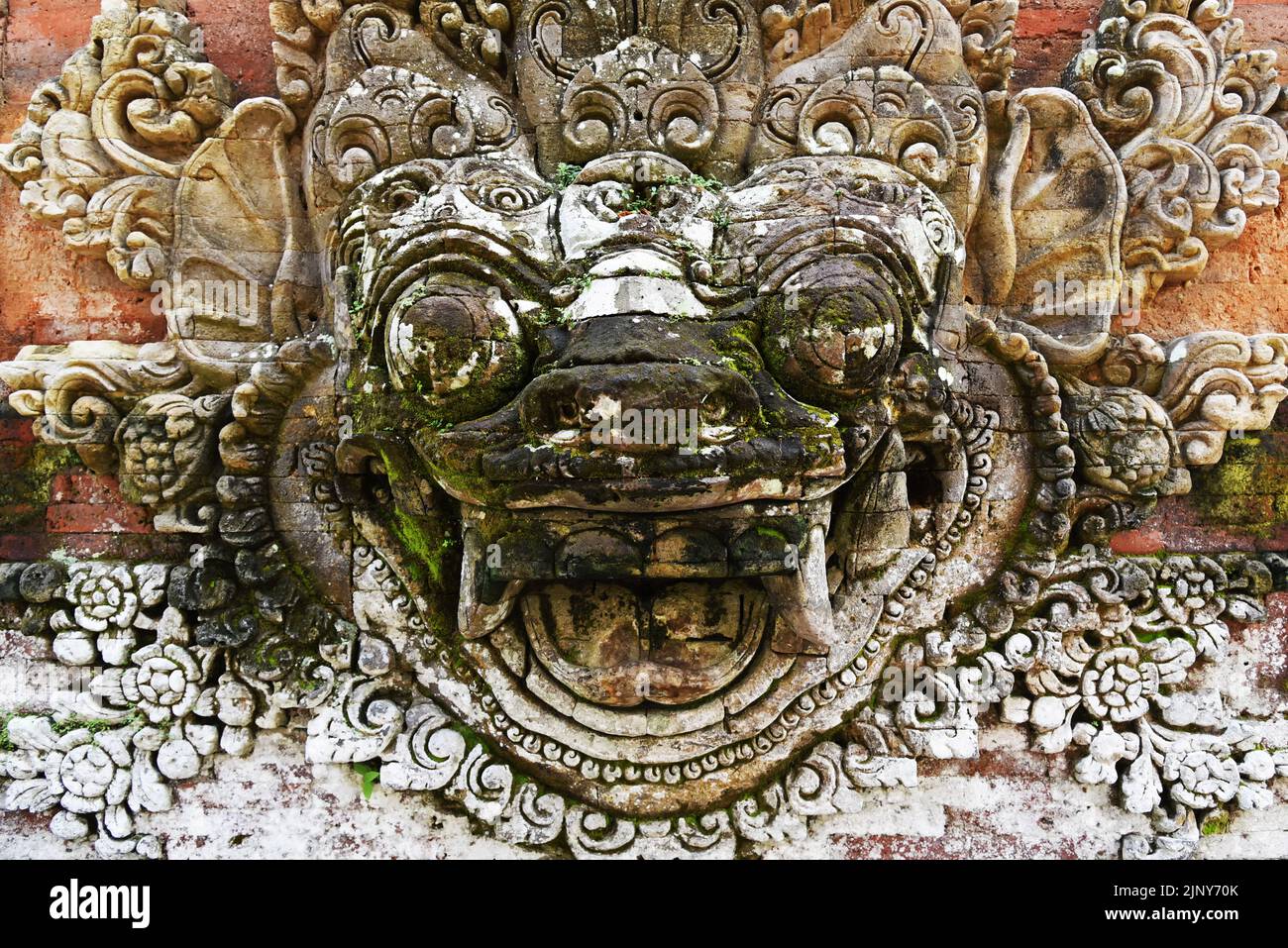Bali deity Demon Barong Face stone carving Stock Photo