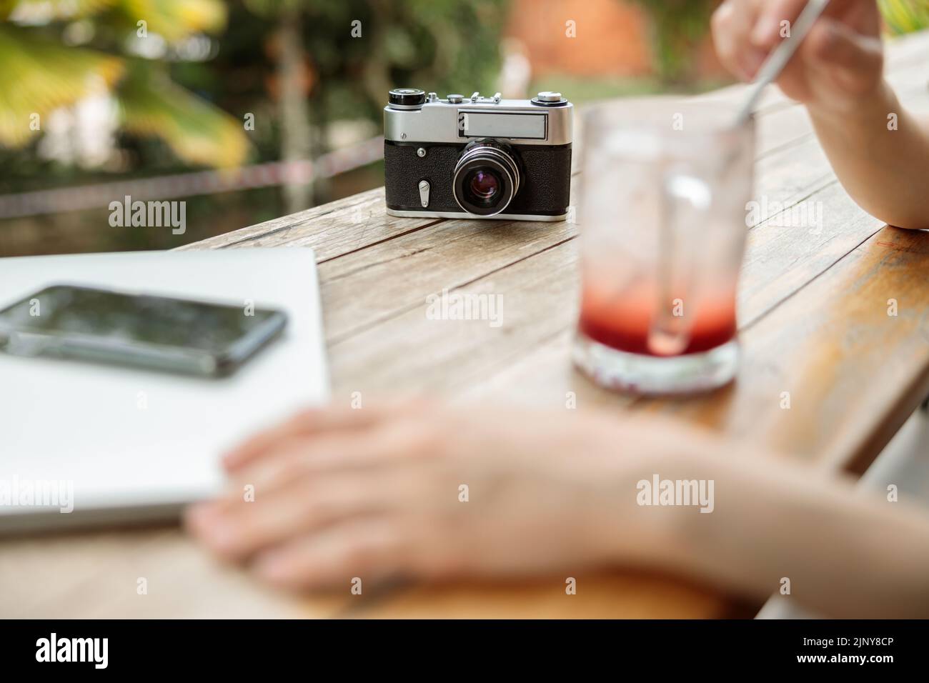 Woman drinking a cool drink through a straw Stock Photo Alamy