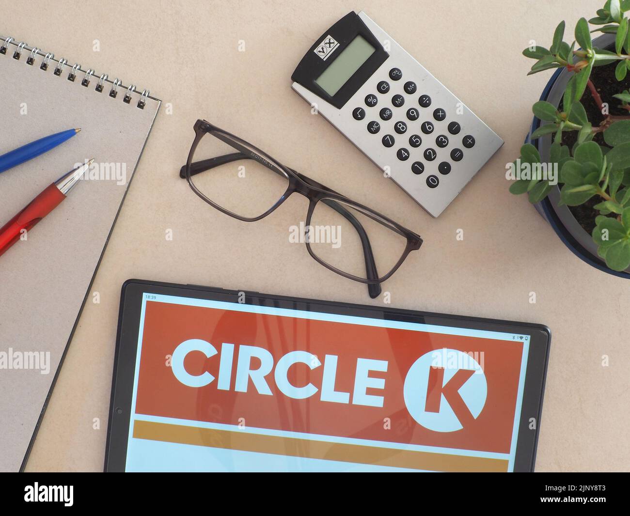 In this photo illustration, Circle K Stores, Inc. logo seen displayed on a tablet Stock Photo