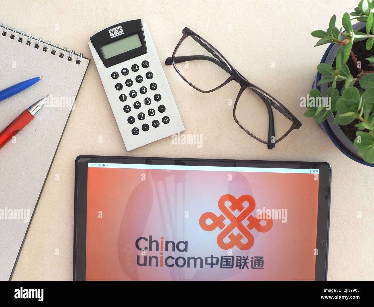 In this photo illustration, China Unicom Group Co., Ltd. logo seen displayed on a tablet Stock Photo