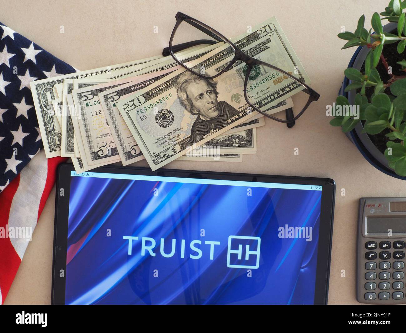 In this photo illustration, Truist Financial Corporation logo seen displayed on a tablet Stock Photo