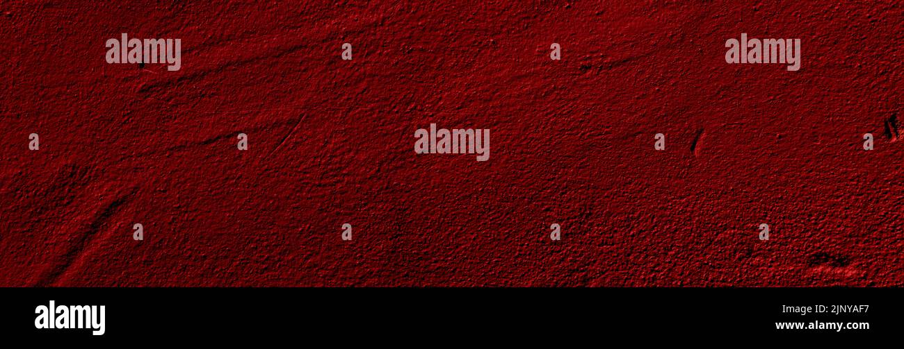 Crimson red colored wide panorama wall background with textures of