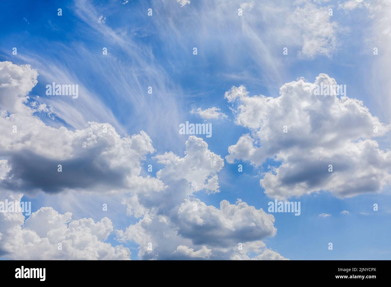White fluffy cloud against a blue sky. Stock Photo