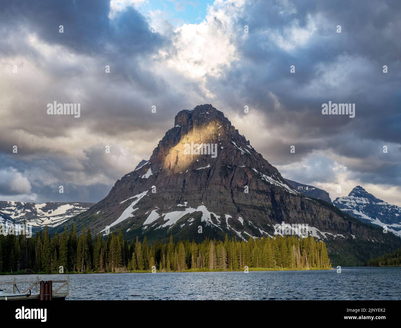 Lake and mountain peak morning in Glacier National Park Stock Photo