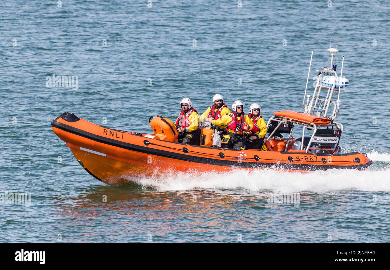 RNLI Life boat racing into the sea after launching from the shore at Blackpool, England in August 2022. Stock Photo