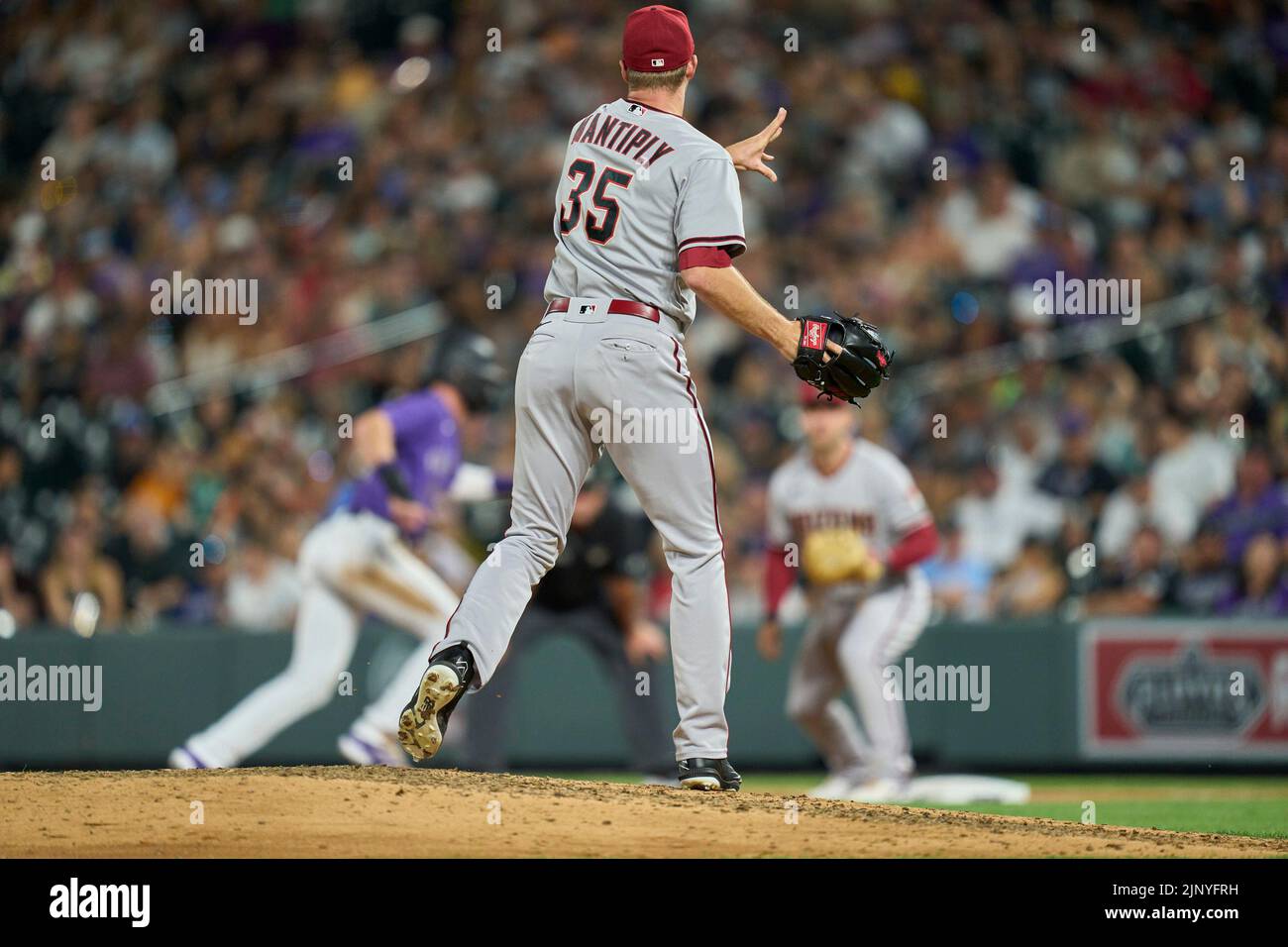 August 13 2022: Arizona pitcher Joe Mantiply (35) throws to first during the game with Arizona Diamondbacks and Colorado Rockies held at Coors Field in Denver Co. David Seelig/Cal Sport Medi Stock Photo