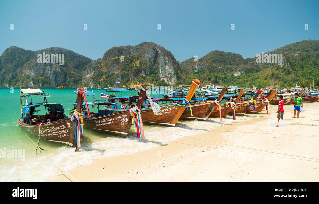 TON SAI BEACH, KRABI , THAILAND. 28 March 2016. Traditional excursion boats on Ton Sai Beach. Stock Photo