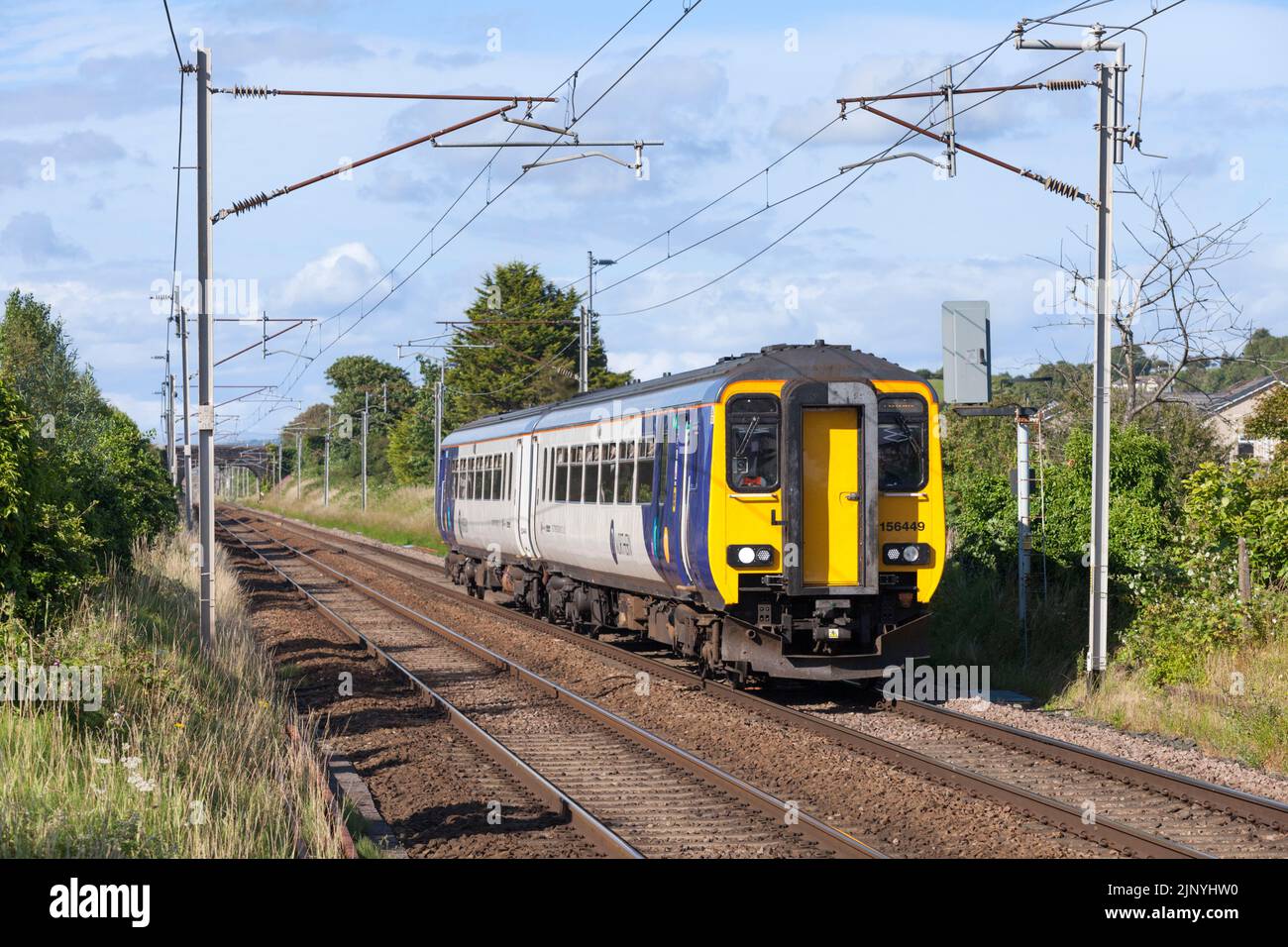 Northern Rail class 156 diesel multiple unit train on the electrified west coast mainline Stock Photo