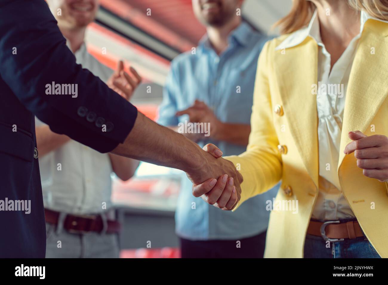 Closing of a business deal by shaking hands in agreement Stock Photo